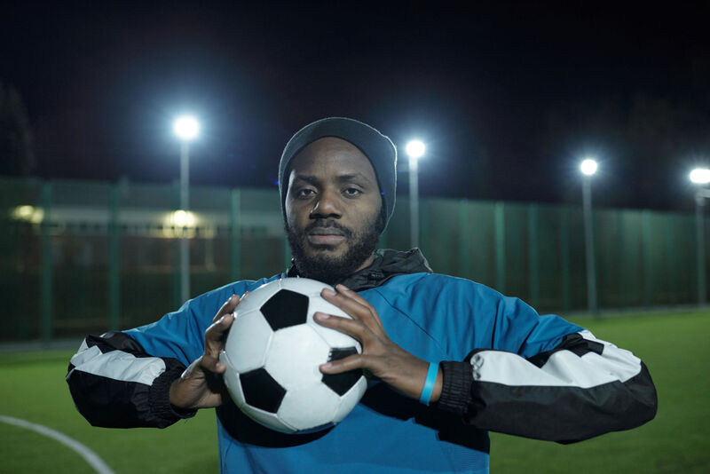 Soccer players train young footballers sportsmanship at Trevon Branch soccer Academy